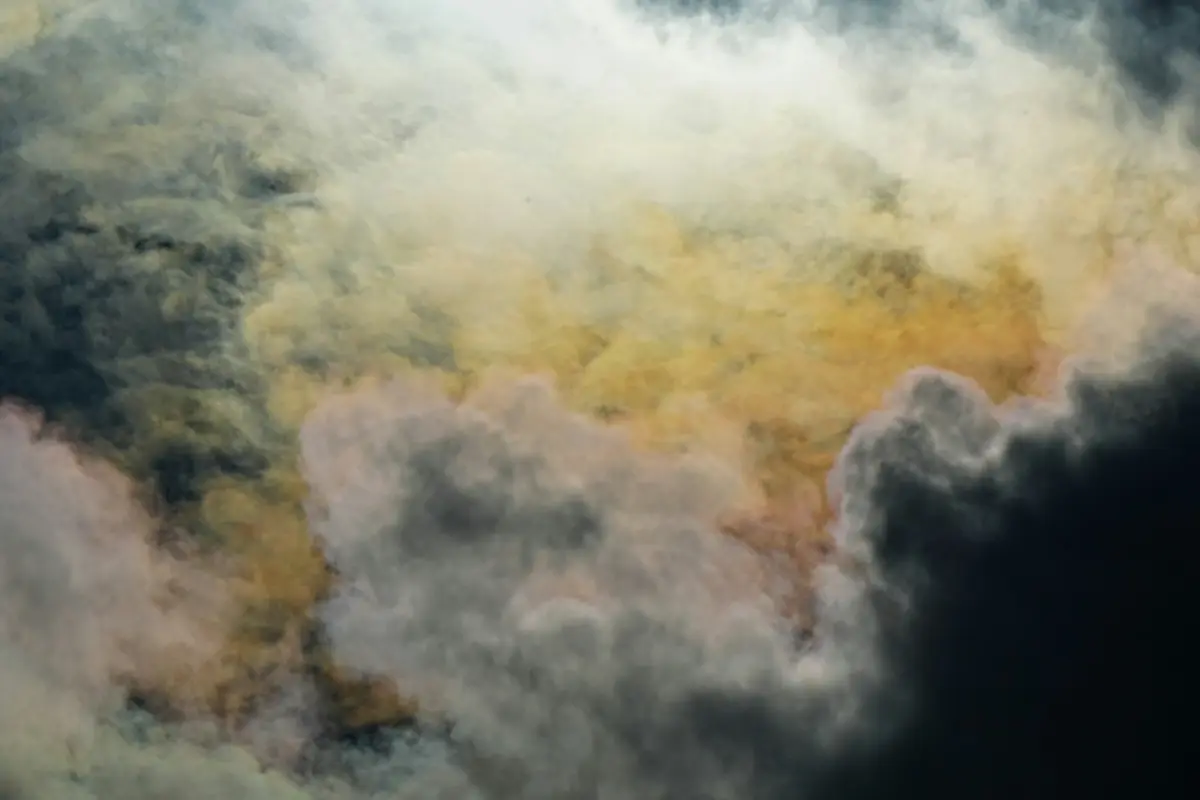 Dramatic clouds with streaks of yellow and pink.
