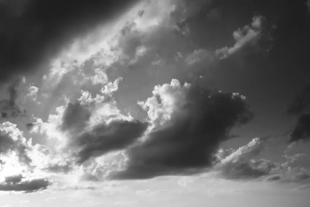 A black and white photo of a cloudy sky